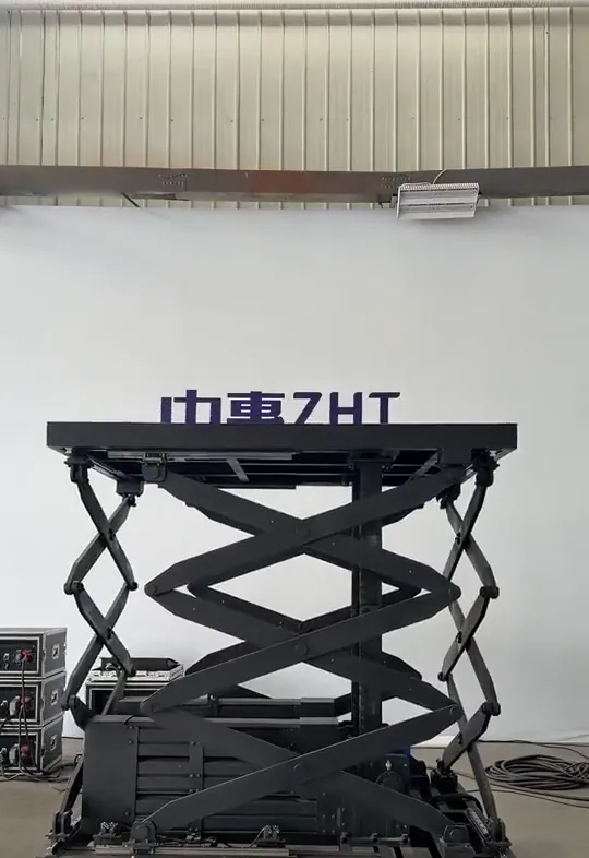 Scissor-guided rigid chain lift table at full height in the Zhonghui factory