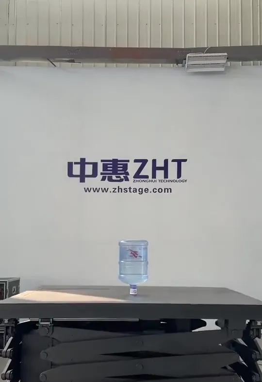 Rigid chain lift table stability test with a full water bottle on the platform